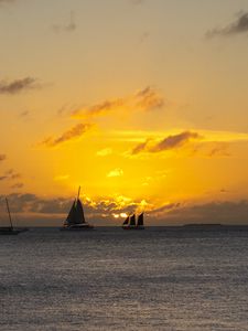 Preview wallpaper boats, ships, sails, silhouettes, sea, sunset