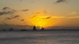 Preview wallpaper boats, ships, sails, silhouettes, sea, sunset