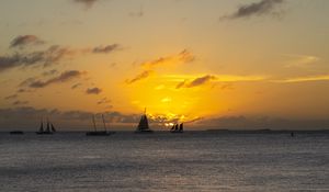 Preview wallpaper boats, ships, sails, silhouettes, sea, sunset