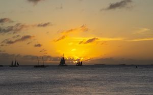 Preview wallpaper boats, ships, sails, silhouettes, sea, sunset