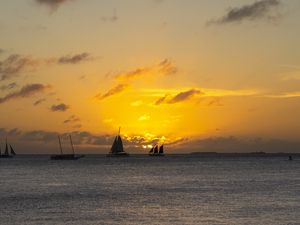 Preview wallpaper boats, ships, sails, silhouettes, sea, sunset