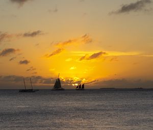 Preview wallpaper boats, ships, sails, silhouettes, sea, sunset