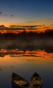 Preview wallpaper boats, sunset, lake, horizon, clouds