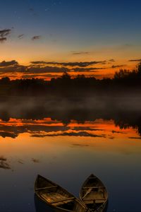 Preview wallpaper boats, sunset, lake, horizon, clouds