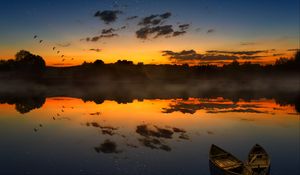 Preview wallpaper boats, sunset, lake, horizon, clouds