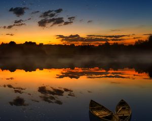 Preview wallpaper boats, sunset, lake, horizon, clouds