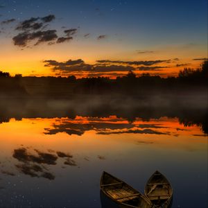 Preview wallpaper boats, sunset, lake, horizon, clouds