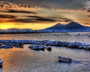 Preview wallpaper boats, vessels, sea, stones, mountains, sky, evening