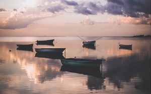 Preview wallpaper boats, water, sunset, dusk, shore