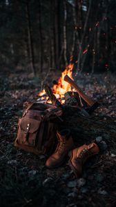 Preview wallpaper bonfire, ax, backpack, boots, nature