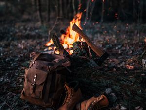 Preview wallpaper bonfire, ax, backpack, boots, nature