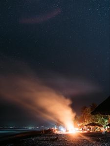 Preview wallpaper bonfire, beach, night, starry sky, smoke, palm trees, bright