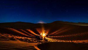 Preview wallpaper bonfire, camping, desert, people, night, starry sky, morocco