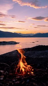 Preview wallpaper bonfire, fire, camping, sea, mountains, sunset