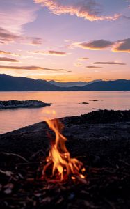 Preview wallpaper bonfire, fire, camping, sea, mountains, sunset