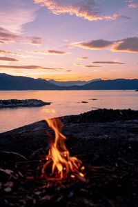 Preview wallpaper bonfire, fire, camping, sea, mountains, sunset