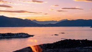 Preview wallpaper bonfire, fire, camping, sea, mountains, sunset