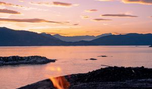 Preview wallpaper bonfire, fire, camping, sea, mountains, sunset