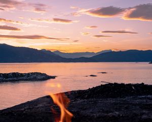 Preview wallpaper bonfire, fire, camping, sea, mountains, sunset