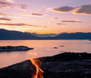 Preview wallpaper bonfire, fire, camping, sea, mountains, sunset