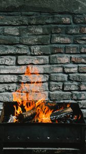 Preview wallpaper bonfire, fire, firewood, wall