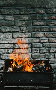 Preview wallpaper bonfire, fire, firewood, wall