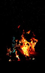 Preview wallpaper bonfire, fire, firewood, sparks, dark, light, camping