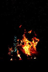 Preview wallpaper bonfire, fire, firewood, sparks, dark, light, camping