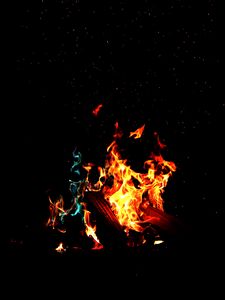 Preview wallpaper bonfire, fire, firewood, sparks, dark, light, camping