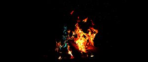 Preview wallpaper bonfire, fire, firewood, sparks, dark, light, camping