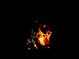 Preview wallpaper bonfire, fire, firewood, sparks, dark, light, camping