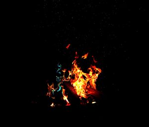 Preview wallpaper bonfire, fire, firewood, sparks, dark, light, camping