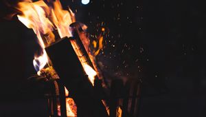 Preview wallpaper bonfire, fire, firewood, sparks, coal