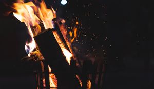 Preview wallpaper bonfire, fire, firewood, sparks, coal