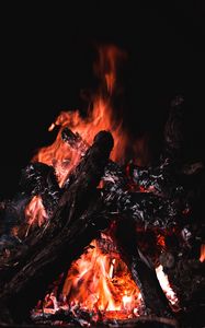 Preview wallpaper bonfire, fire, firewood, embers, dark