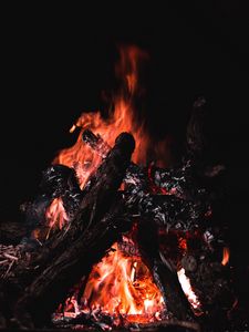 Preview wallpaper bonfire, fire, firewood, embers, dark