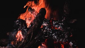 Preview wallpaper bonfire, fire, firewood, embers, dark