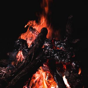 Preview wallpaper bonfire, fire, firewood, embers, dark