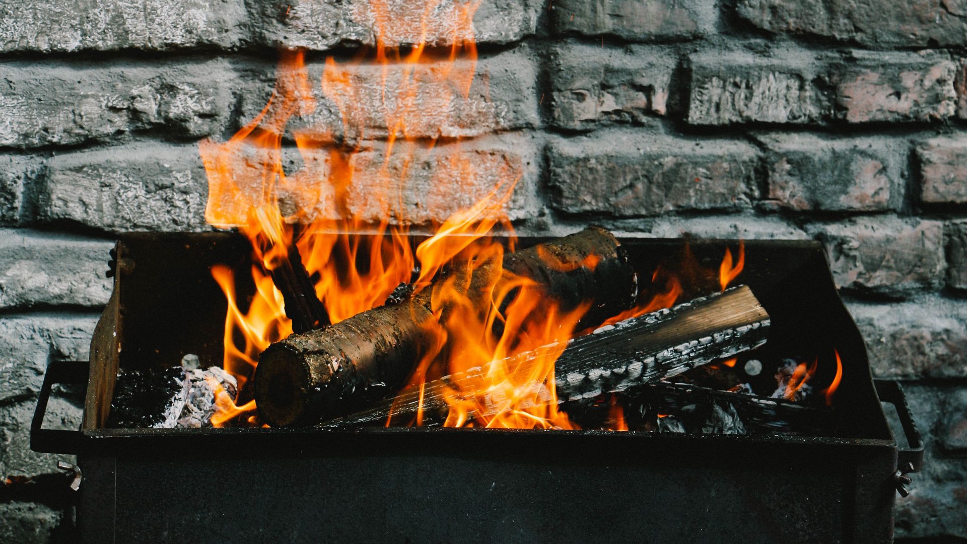 Download wallpaper 1920x1080 bonfire, fire, firewood, wall full hd