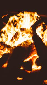 Preview wallpaper bonfire, fire, flame, firewood, dark, blur