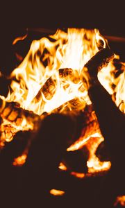 Preview wallpaper bonfire, fire, flame, firewood, dark, blur