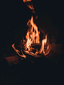 Preview wallpaper bonfire, fire, flame, firewood, night, darkness, dark