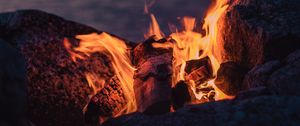 Preview wallpaper bonfire, fire, flame, stones, firewood