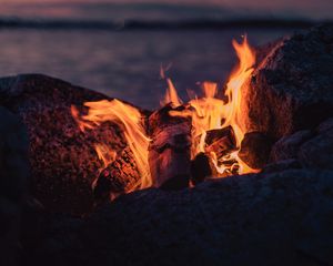 Preview wallpaper bonfire, fire, flame, stones, firewood