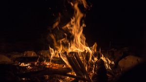 Preview wallpaper bonfire, fire, flame, branches, dark