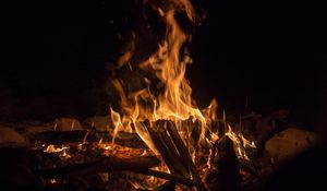 Preview wallpaper bonfire, fire, flame, branches, dark