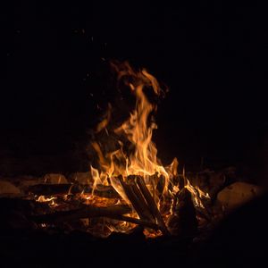 Preview wallpaper bonfire, fire, flame, branches, dark