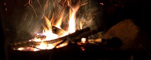 Preview wallpaper bonfire, fire, flame, sparks, night, firewood