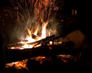 Preview wallpaper bonfire, fire, flame, sparks, night, firewood