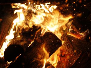 Preview wallpaper bonfire, fire, flames, coals, firewood, sparks
